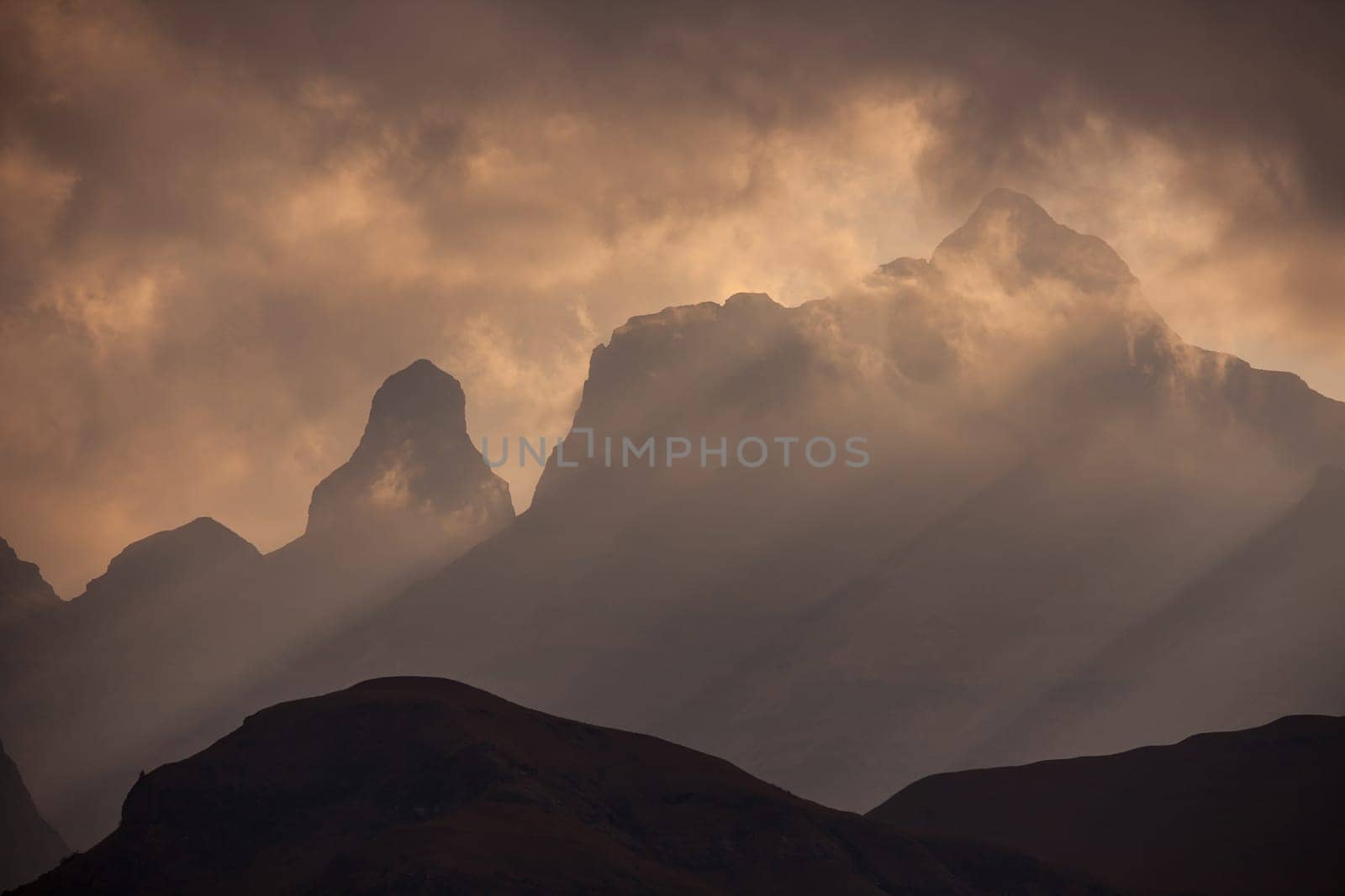 A stormy sunset at Cathedral Peak in the Drakensberg Mountains. KwaZulu-Natal Province, South Africa