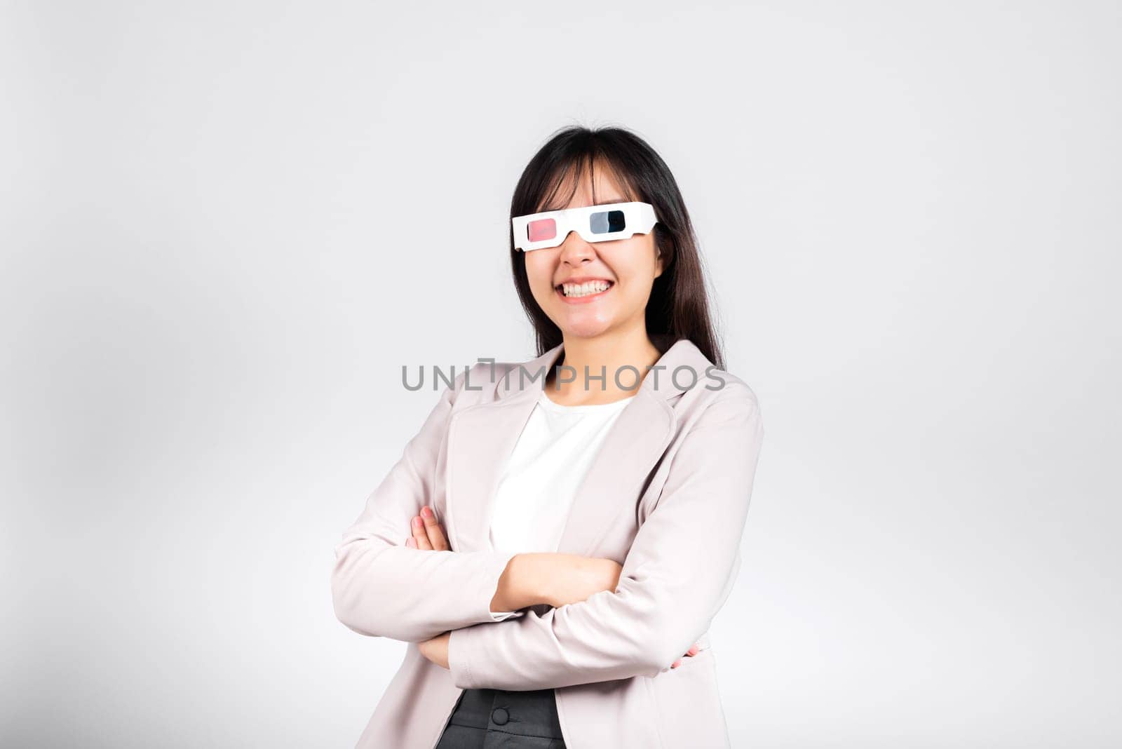 Smiling woman confidence wearing 3d cinema movie glasses red and blue isolated white background, Asian happy portrait beautiful young female in television film studio shot, copy space