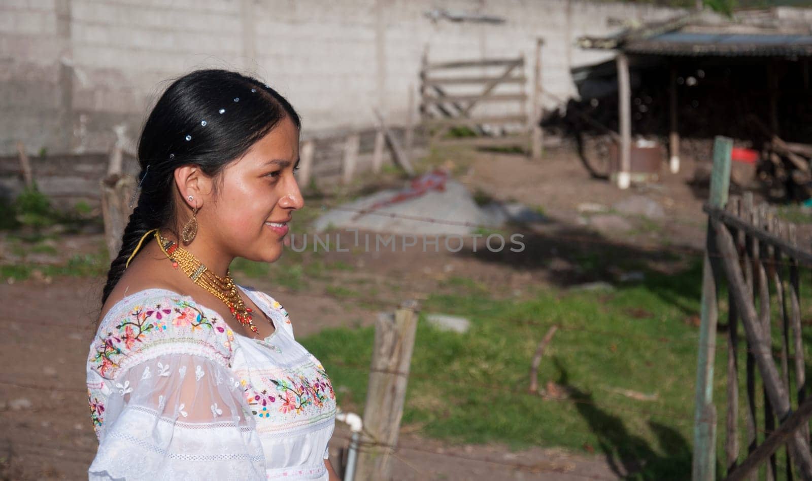 copy-space of a South American girl on her farm tending her land in traditional dress from Otavalo, Ecuador.Hispanic Heritage Month. High quality photo