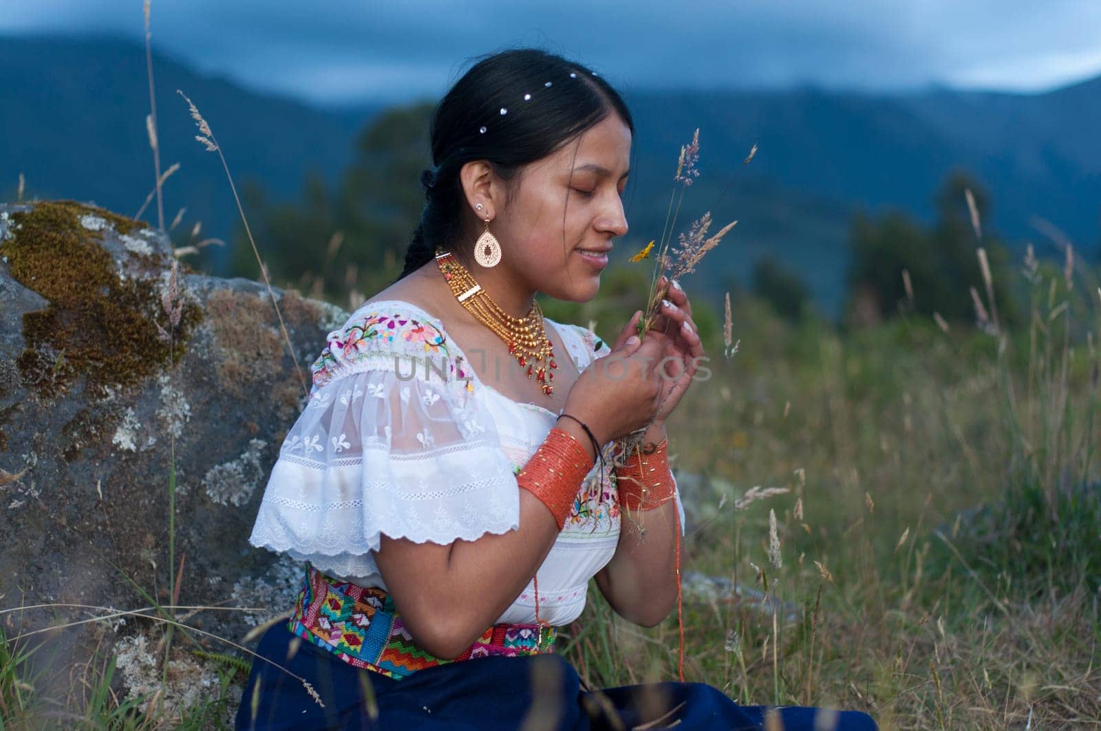 Indian girl picking the fruit of the harvest from the fields and feeling the happiness of the smell of the earth.Hispanic Heritage Month. High quality photo
