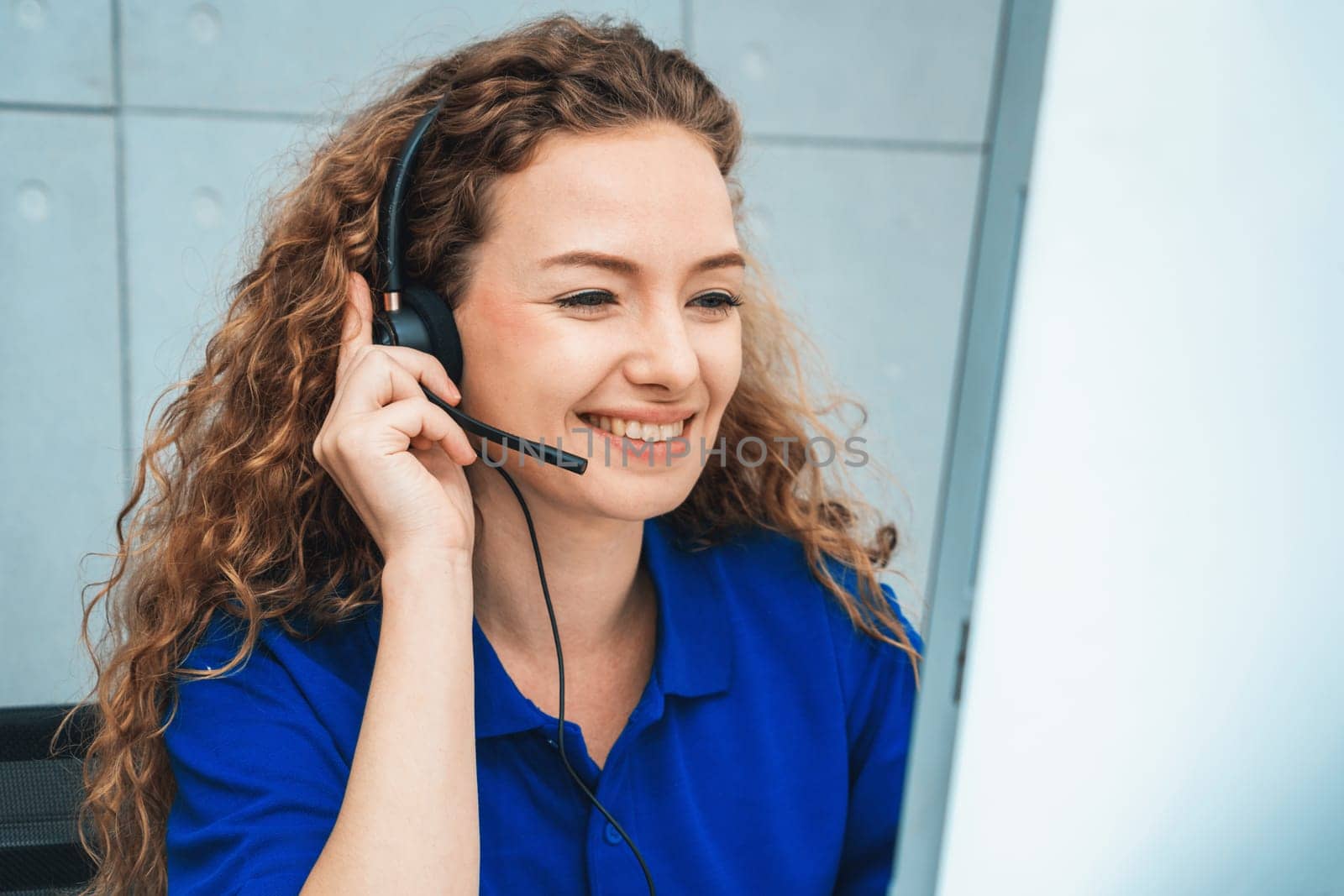 Business people wearing headset working in office to support remote customer or colleague. Call center, telemarketing, customer support agent provide service on telephone video conference call. Jivy