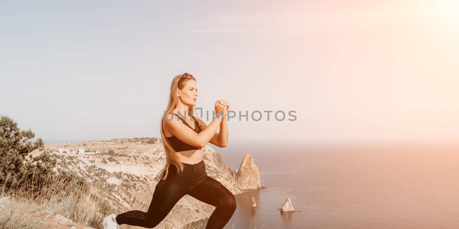 Fitness woman sea. Outdoor workout on yoga mat in park near to ocean beach. Female fitness pilates yoga routine concept. Healthy lifestyle. Happy fit woman exercising with rubber band in park. by panophotograph