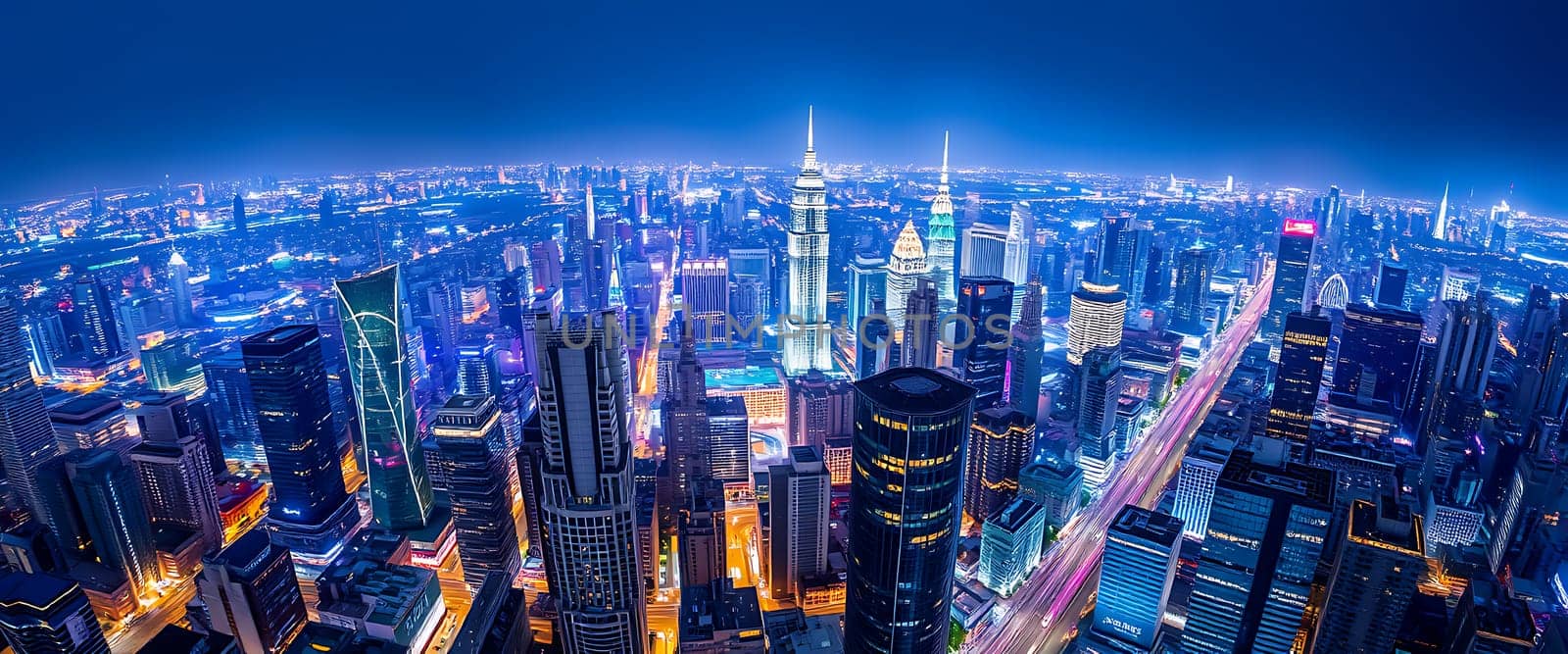 The city skyline glows with colorful lights at night, showcasing towering skyscrapers, busy streets, and a vibrant atmosphere that highlights urban life.