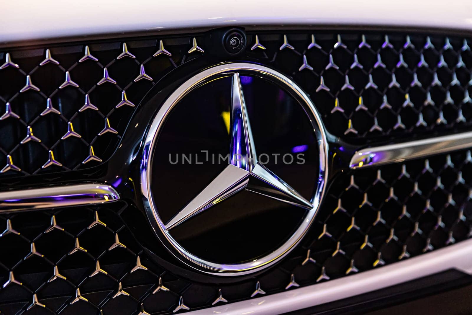Kyiv, Ukraine - September 12, 2024: Mercedes-Benz logo on a luxury car grille, highlighting the brand's sleek design and premium craftsmanship
