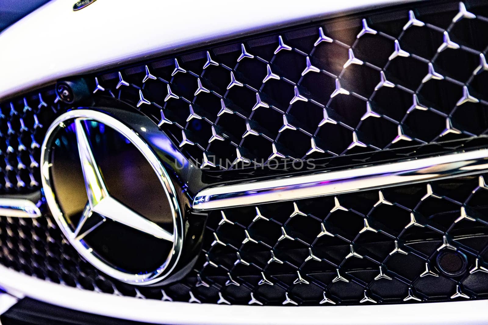 Kyiv, Ukraine - September 12, 2024: Mercedes-Benz logo on a luxury car grille, highlighting the brand's sleek design and premium craftsmanship