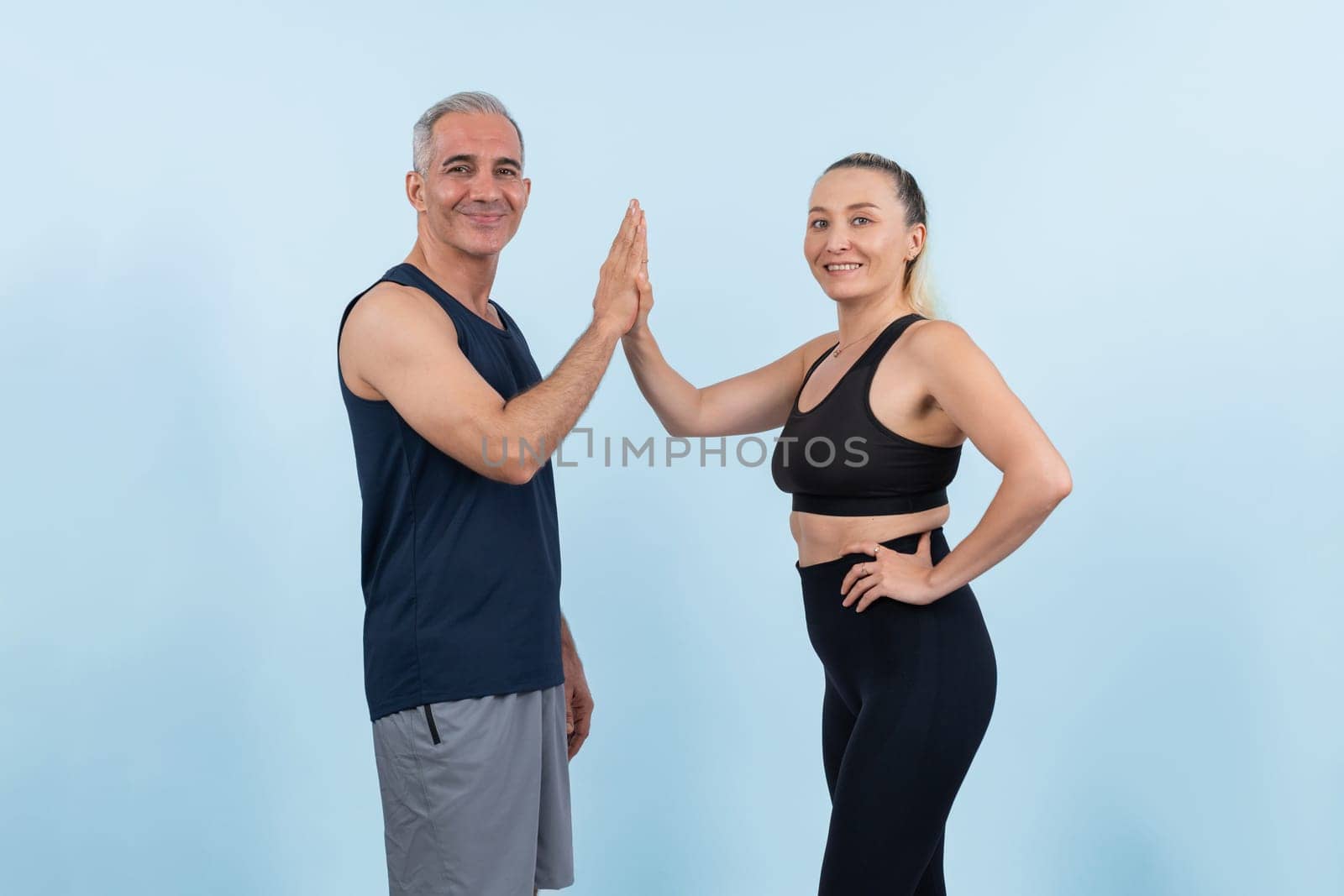 Active and fit physique senior people portrait with happy smile on isolated background. Healthy lifelong senior couple with fitness healthy and sporty body care lifestyle concept. Clout