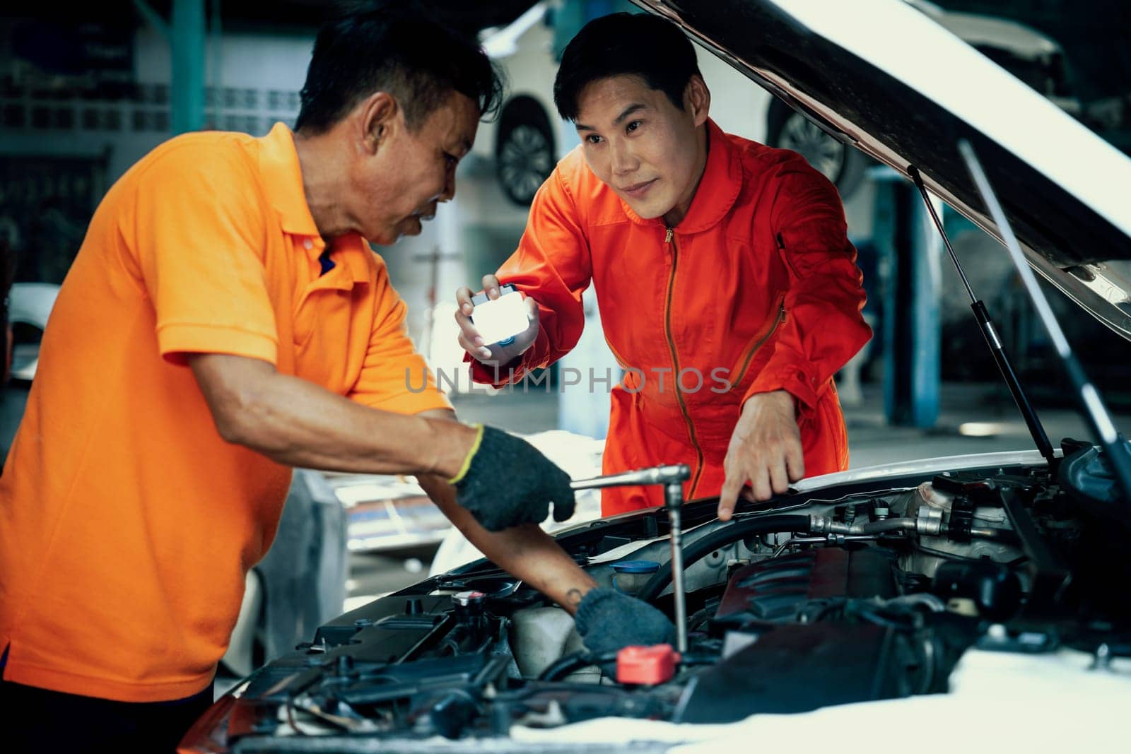 Automotive service mechanic inspect and diagnose car engine. Oxus by biancoblue