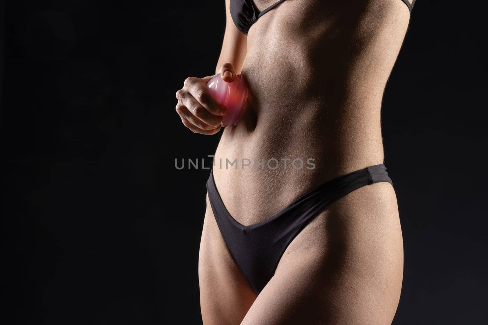 woman using Silicone Anti-Cellulite Vacuum Massage Cups for Self-Massage close-up on body, Self massage tool