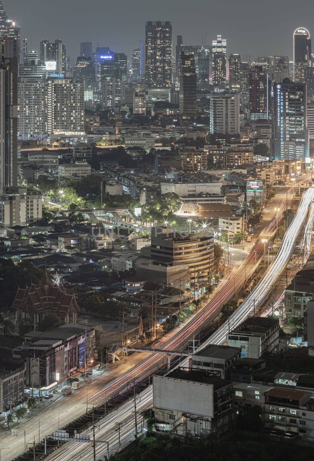Bangkok, Thailand - 16 Sep, 2024 - City night view of Bangkok city skyscrapers after sunset. Bangkok downtown cityscape in Business district with bright glowing lights at night, Space for text, Selective focus.