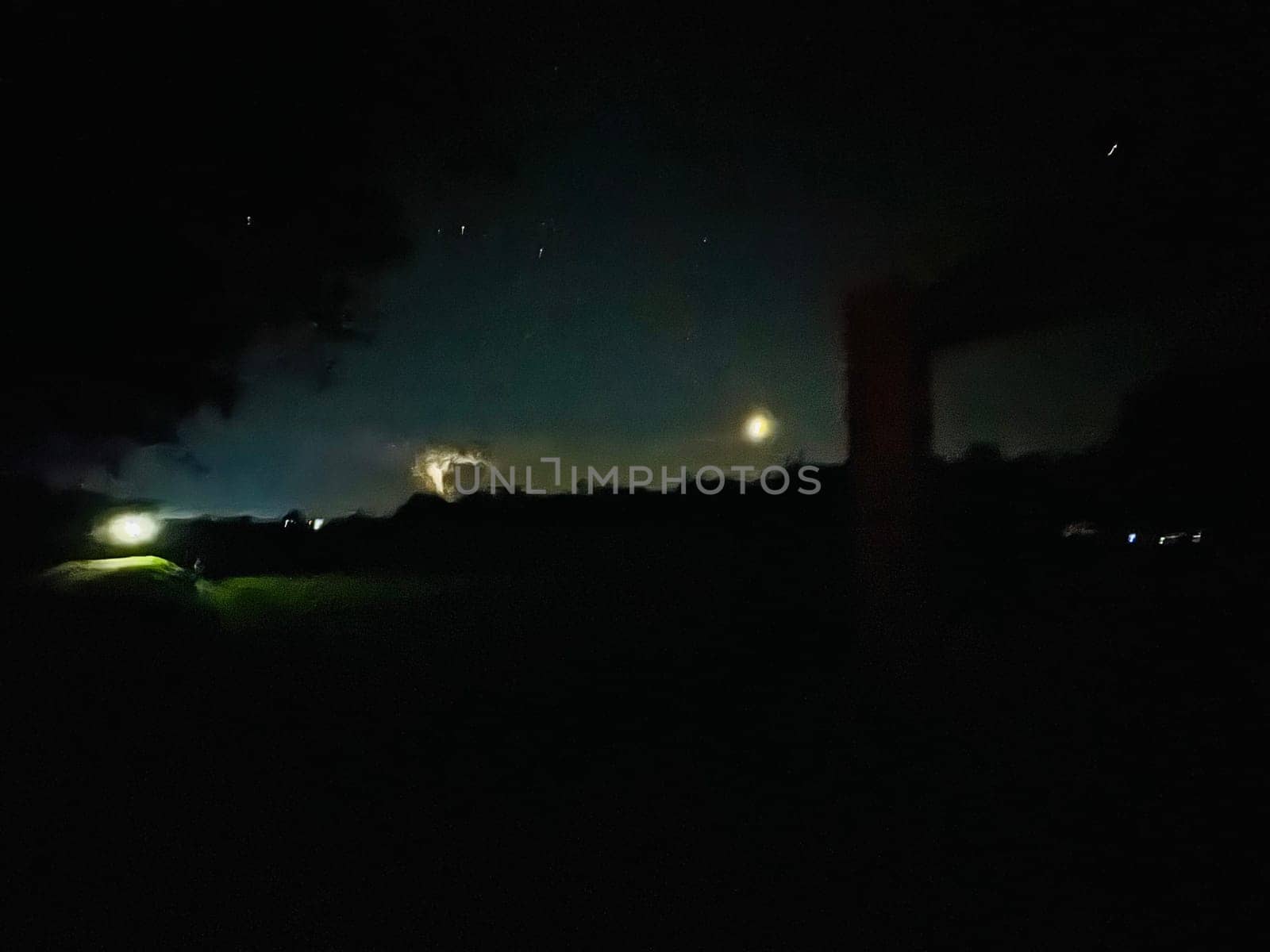 a night sky with trees and stars. High quality photo