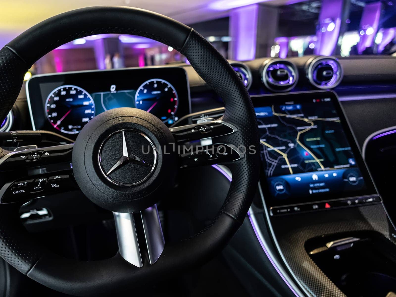 Kyiv, Ukraine - September 12: Mercedes-Benz luxury car interior showcasing the sleek design of the steering wheel, digital dashboard, and advanced navigation system