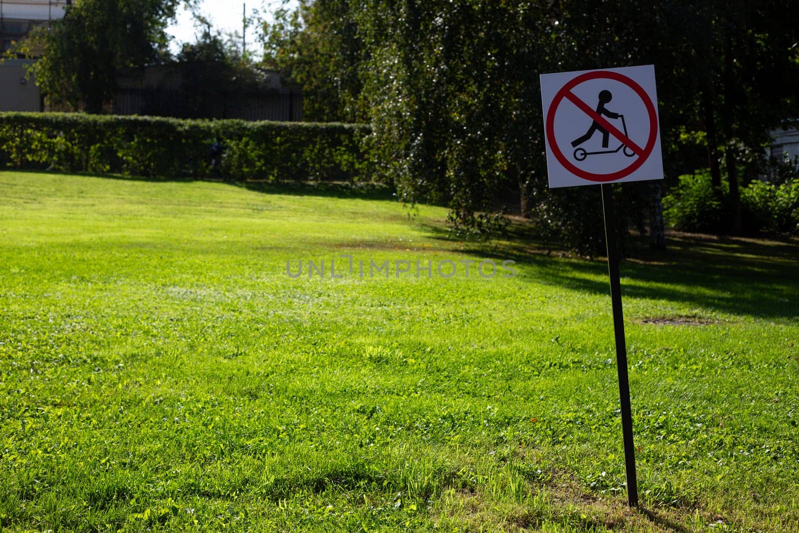 Special sign for rules in public park prohibiting riding electric scooters. Traffic regulation on the streets of a modern city. No allow scooter