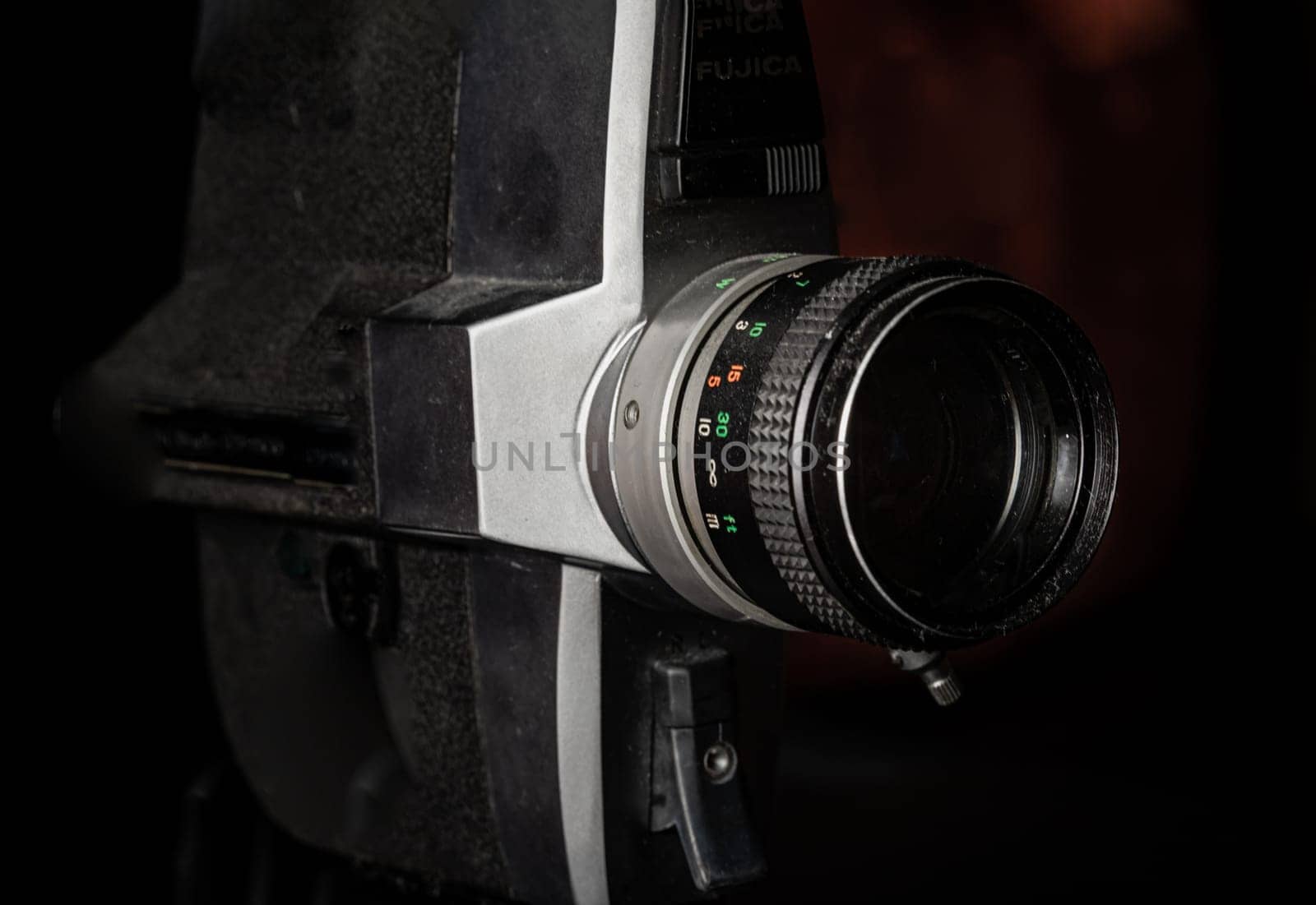 Bangkok, Thailand - 17 Sep, 2024 - Close-up of Old movie camera 8mm with black background. Light and Shadow, Copy space, Selective focus.