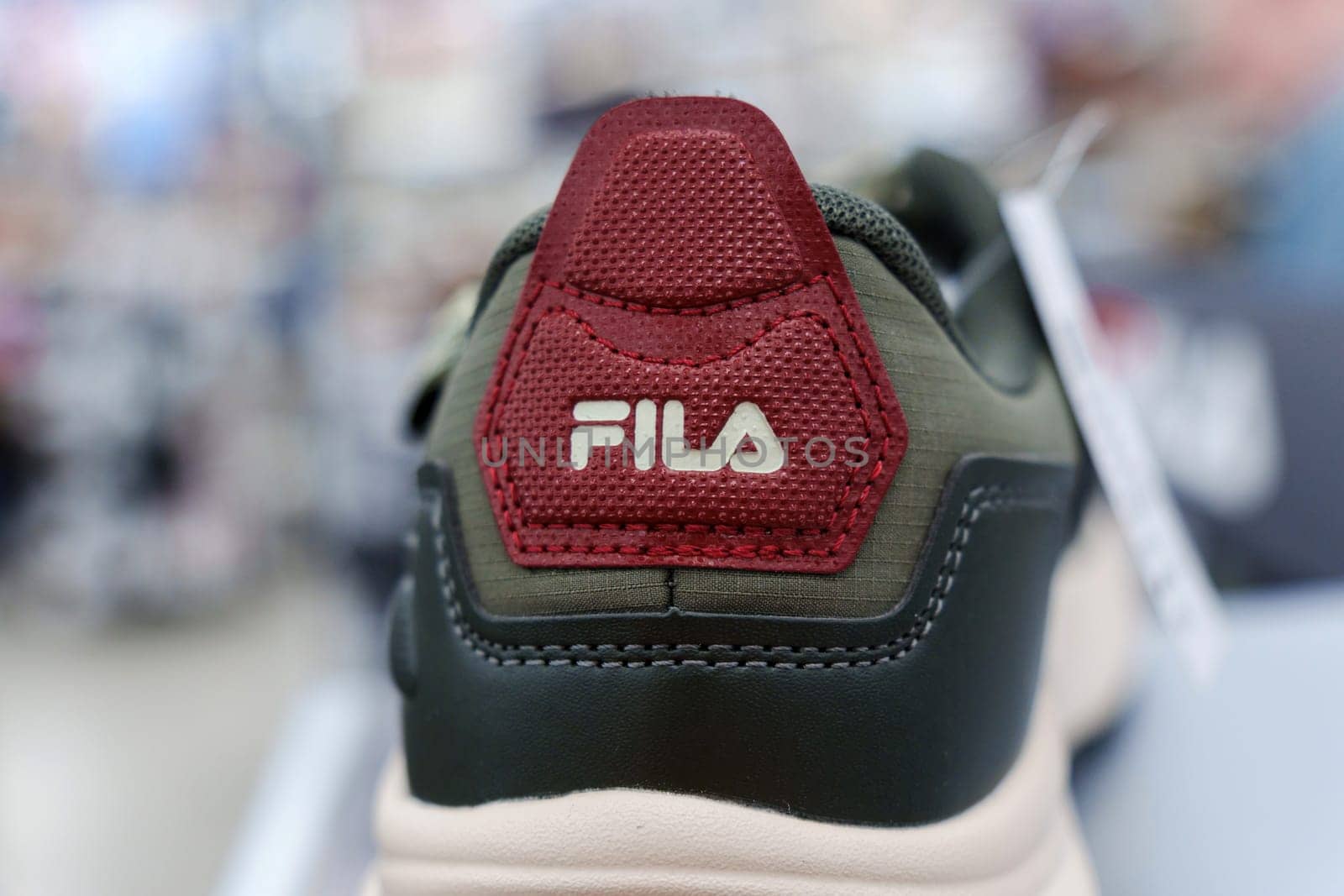 Tyumen, Russia-August 11, 2024: Close-up of a Fila sneaker showcasing the intricate lacing and design in a retail store