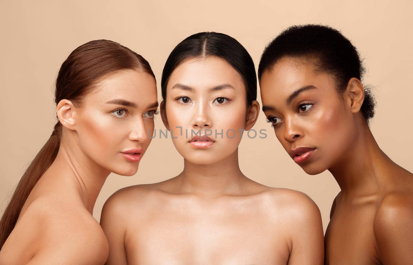 Three Naked Women Models Standing Shirtless Posing In Studio On Gray Background. Natural Female Beauty