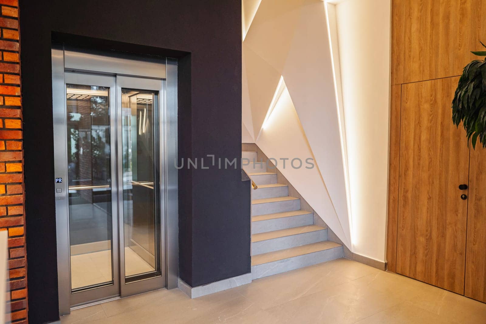 The spacefeatures elegant doors that add charm and style to the space. The design and craftsmanship of the doors stand out in the well-appointed space, creating a visually striking focal point.