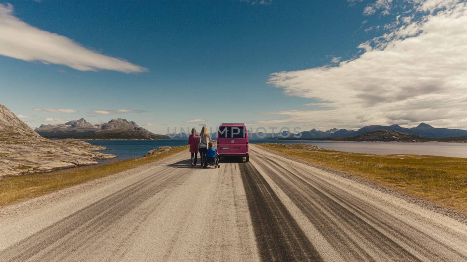 Two individuals in a car, admiring stunning ocean views as the sun sets, creating a warm and picturesque atmosphere on their journey.
