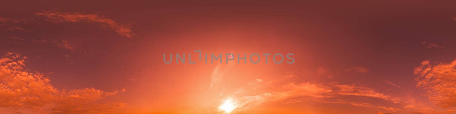 Dramatic Sunset sky 360 panorama. Vibrant sky with bright glowing red pink Cumulus clouds. HDR 360 seamless spherical panorama. Sky dome for aerial drone panoramas. Climate and weather change