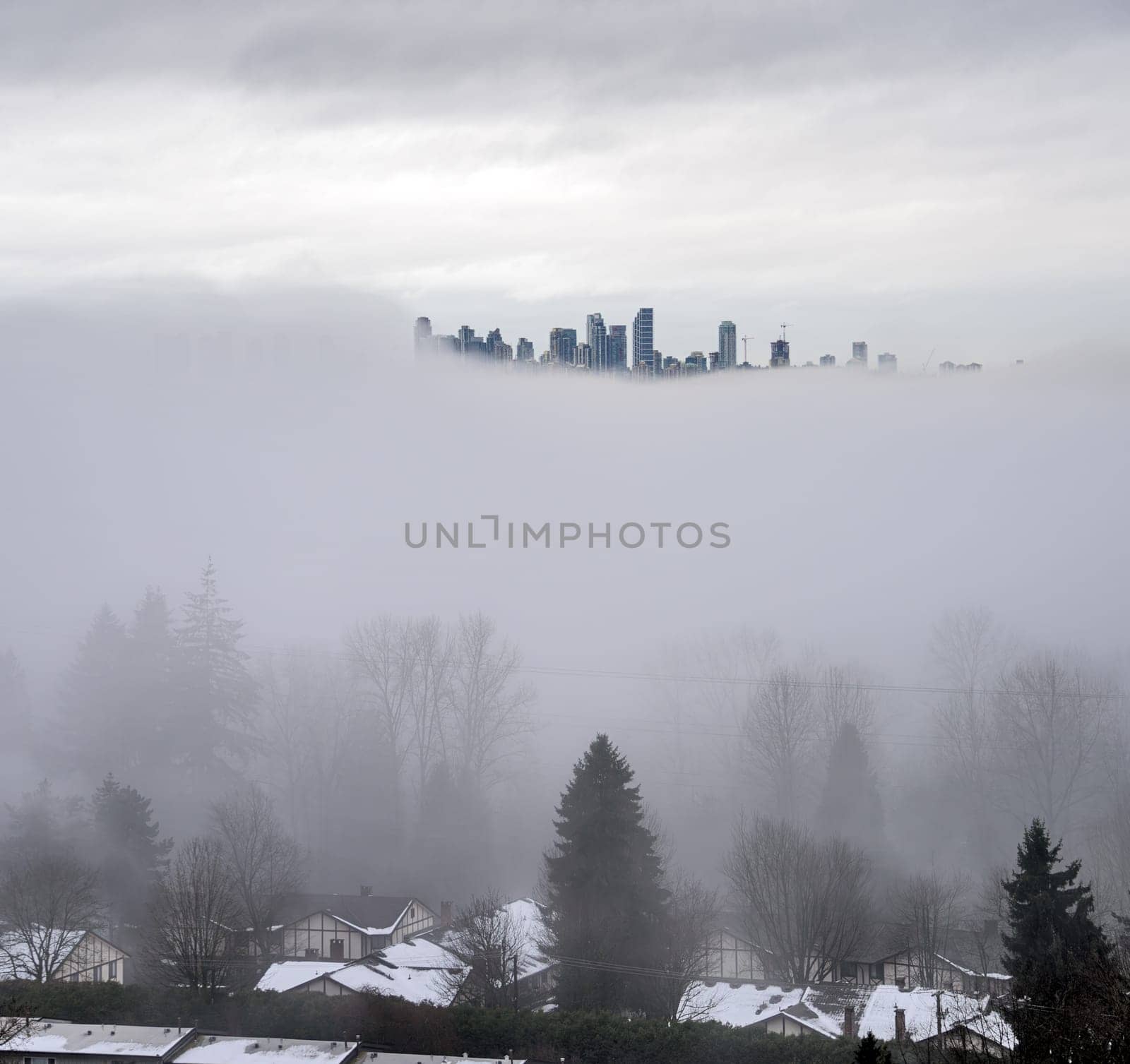 City in the sky. Foggy winter morning in Vancouver, Canada.