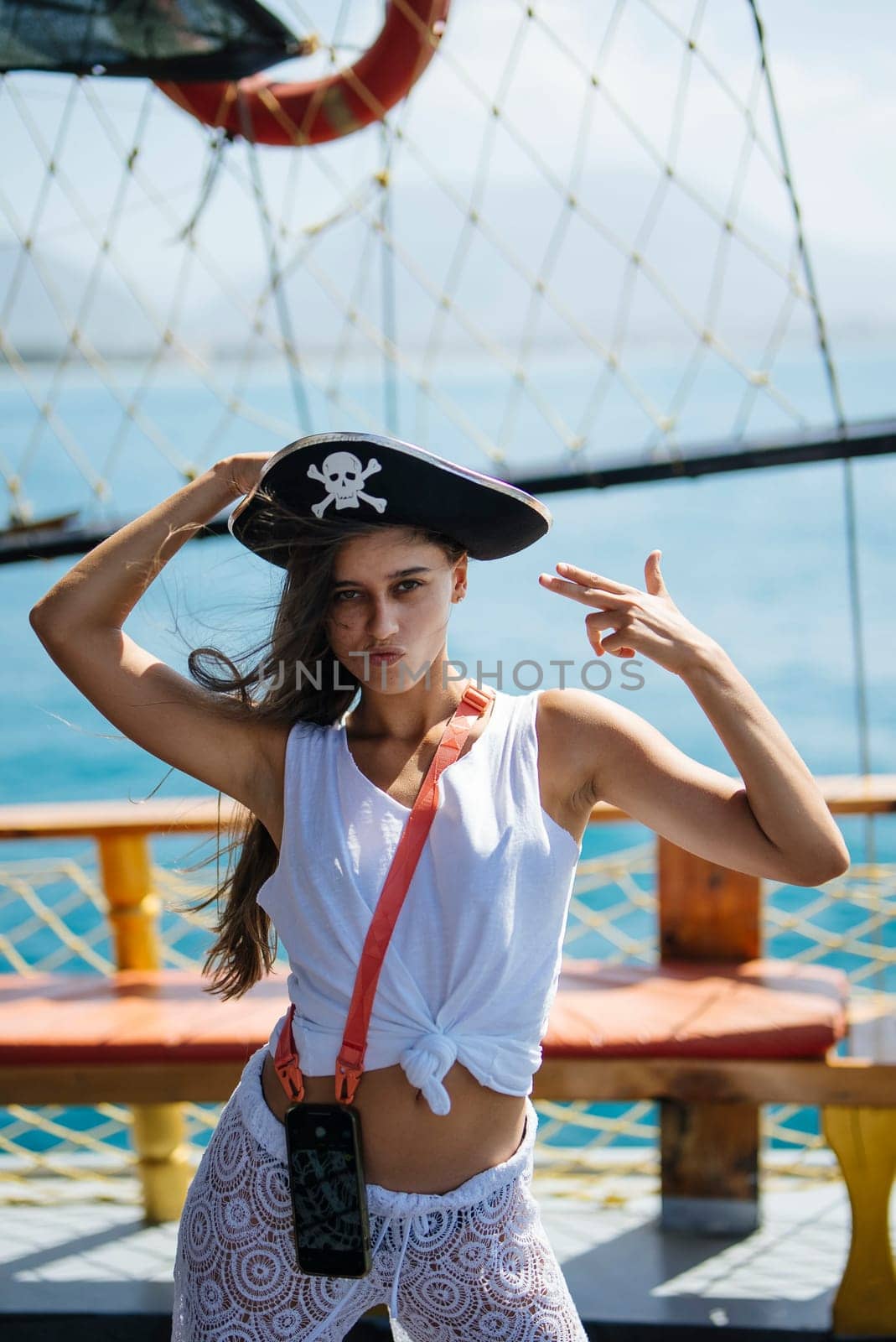 Enjoying a funfilled piratethemed photo shoot aboard an exciting ship, beautifully showcasing confidence and style