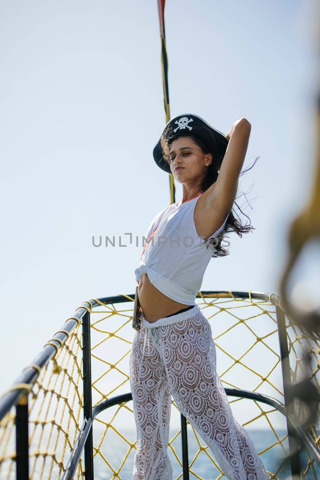 An extraordinary and striking piratethemed fashion photoshoot featuring a stunning model on a boat