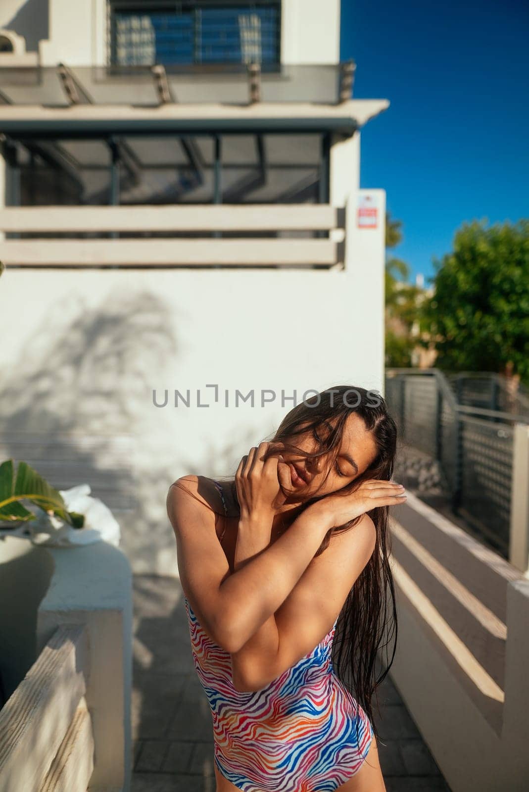 A vibrant and joyful moment captured outdoors, reflecting the true essence of summer spirit and relaxation by the pool