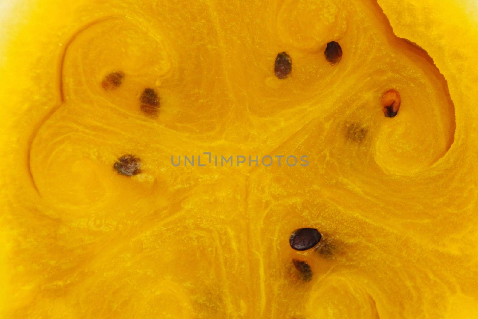 A freshly cut yellow watermelon reveals its bright, sunny flesh
