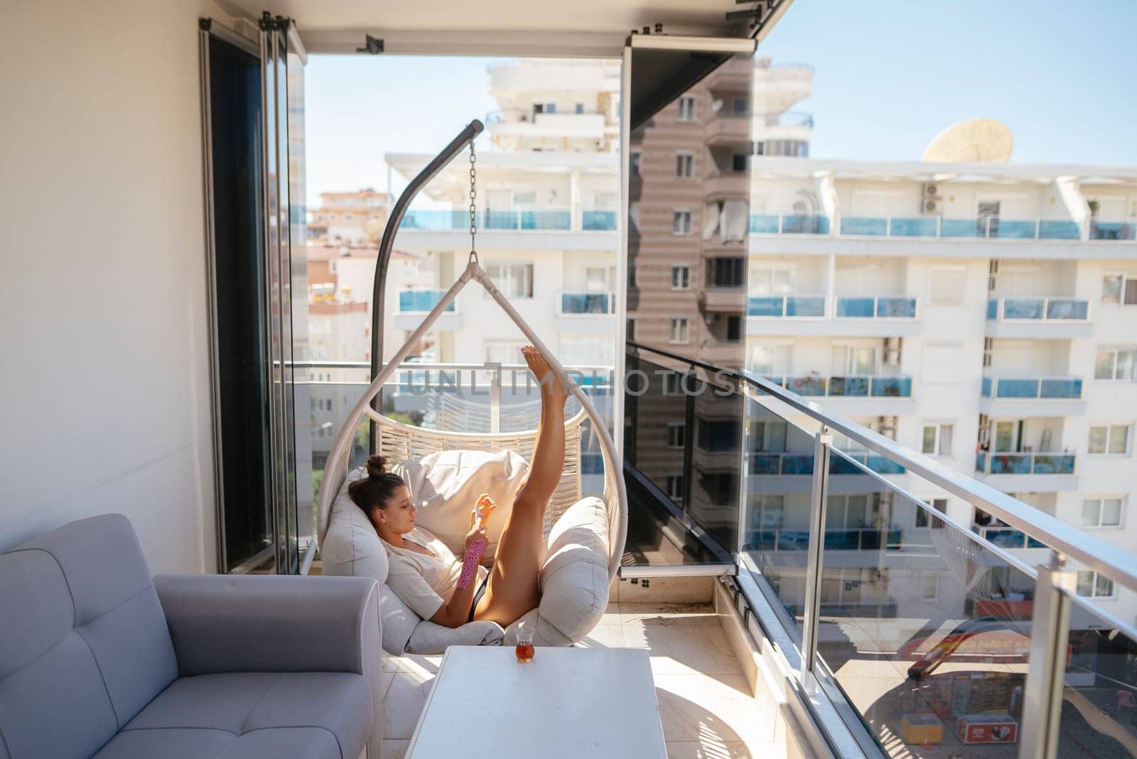 Imagine enjoying a tranquil moment on a beautifully styled balcony, offering stunning views of the vibrant city
