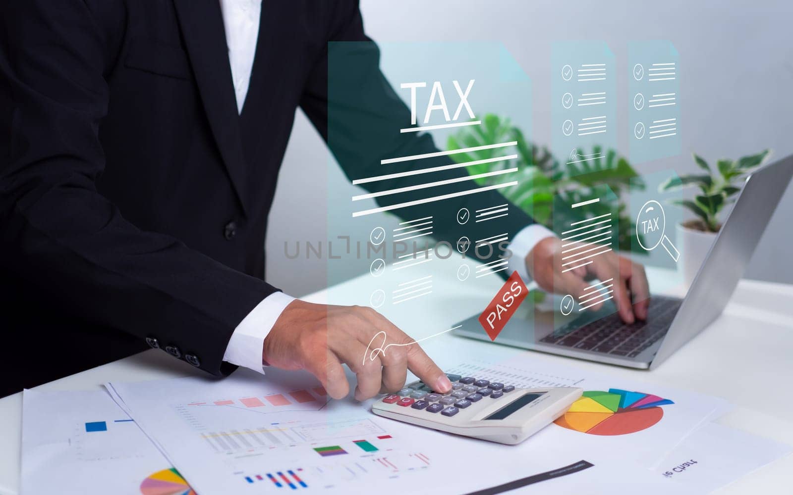 Businessman using a computer to complete Individual income tax return form online for tax payment. financial research, report, Calculation. by Unimages2527