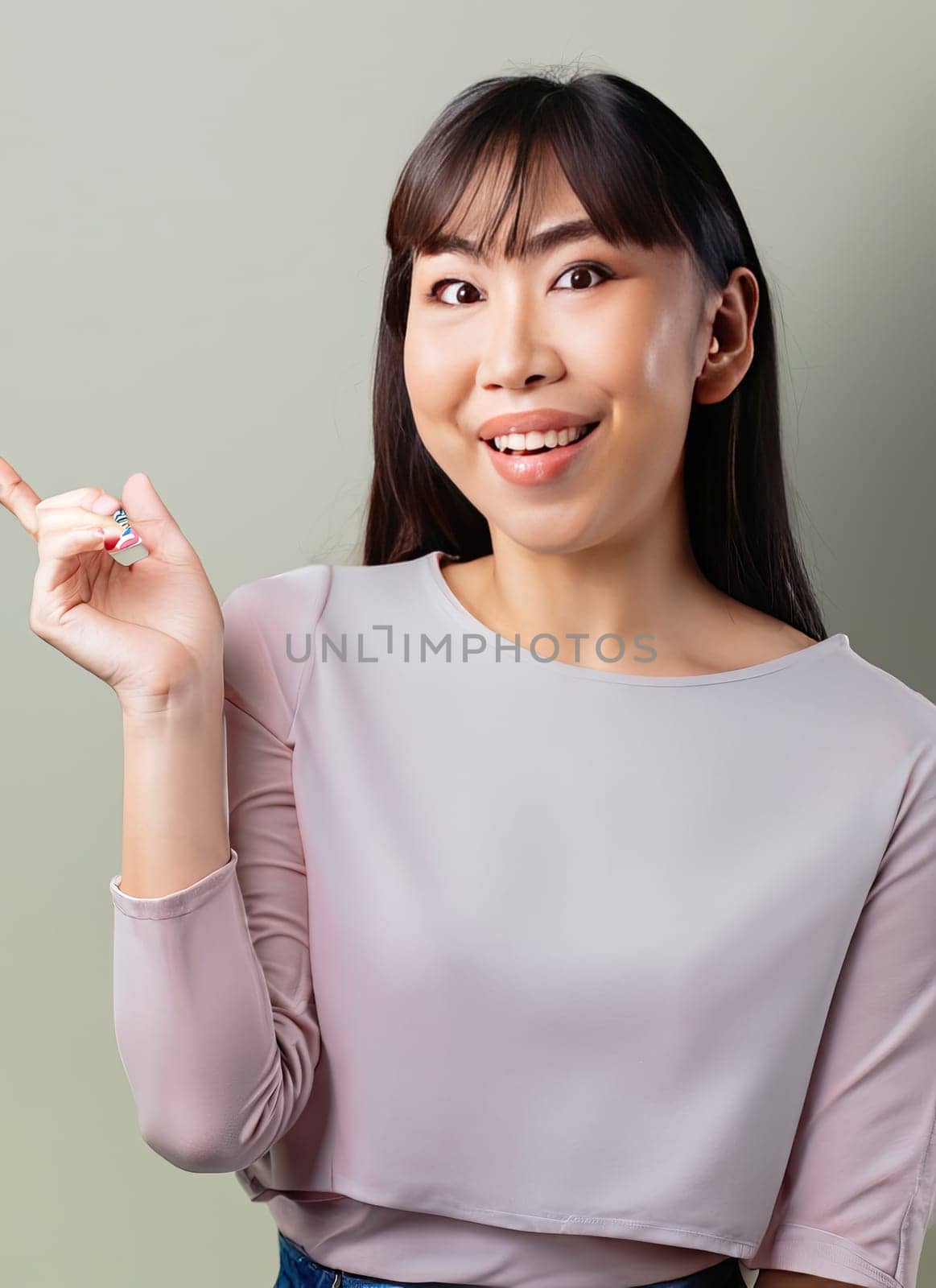 Portrait of young beautiful Asian lady smiling with cheerful expression, shows something amazing at blank space banner background poster wallpaper. AI Generative.