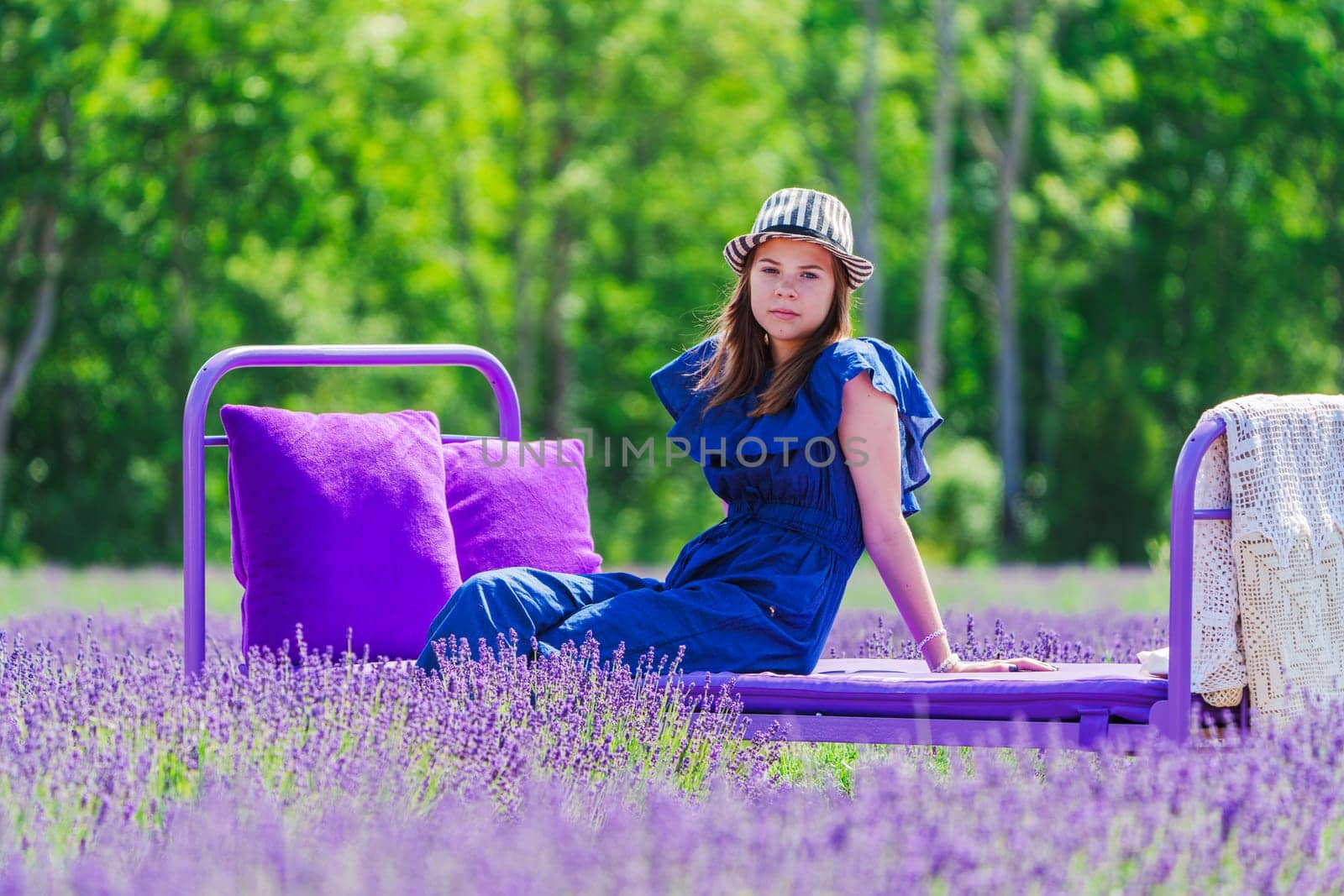 Enchanting Elegance: A Beautiful Girl amidst Lavender Fields. A Dreamy Summer Photo Session in the Lavender Field