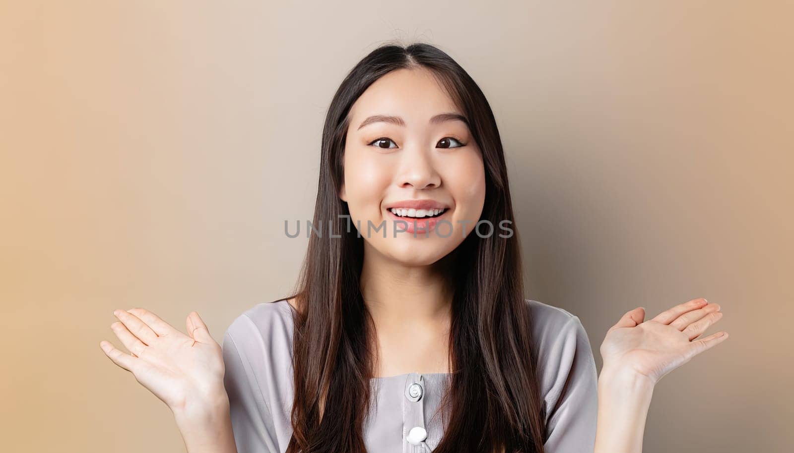 Portrait of young beautiful Asian lady smiling with cheerful expression, shows something amazing at blank space banner background poster wallpaper. AI Generative.