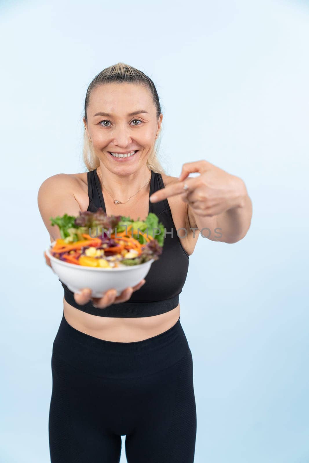 Happy smile senior woman portrait holding bowl of vegan. Clout by biancoblue