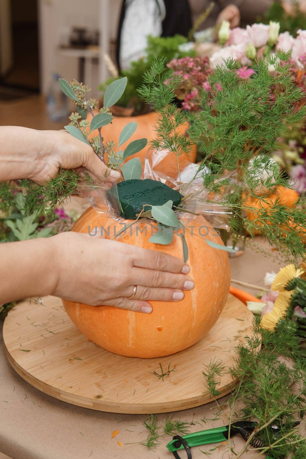 Creating a floral composition in a pumpkin. Making decor with your own hands