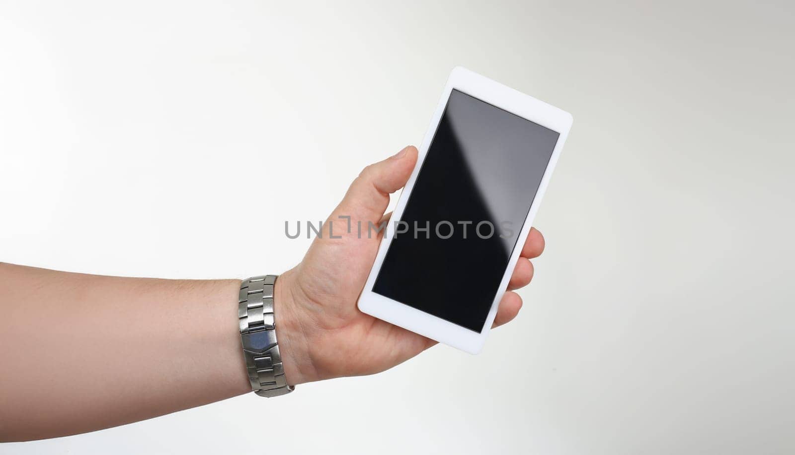 Close-up of man hold cellphone with locked or turned off black screen. Mobile phone not work, useless gadget model. Mockup, technology concept. Copy space