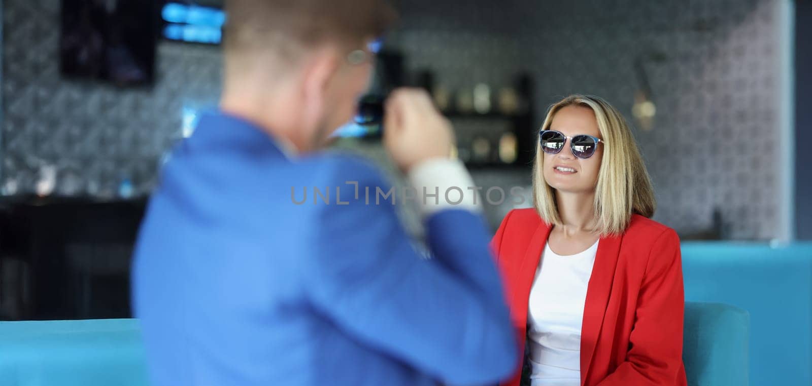 Portrait of stylish dressed woman on meeting with presentable man, consultant give advice. Successful people discuss something. Business meeting concept