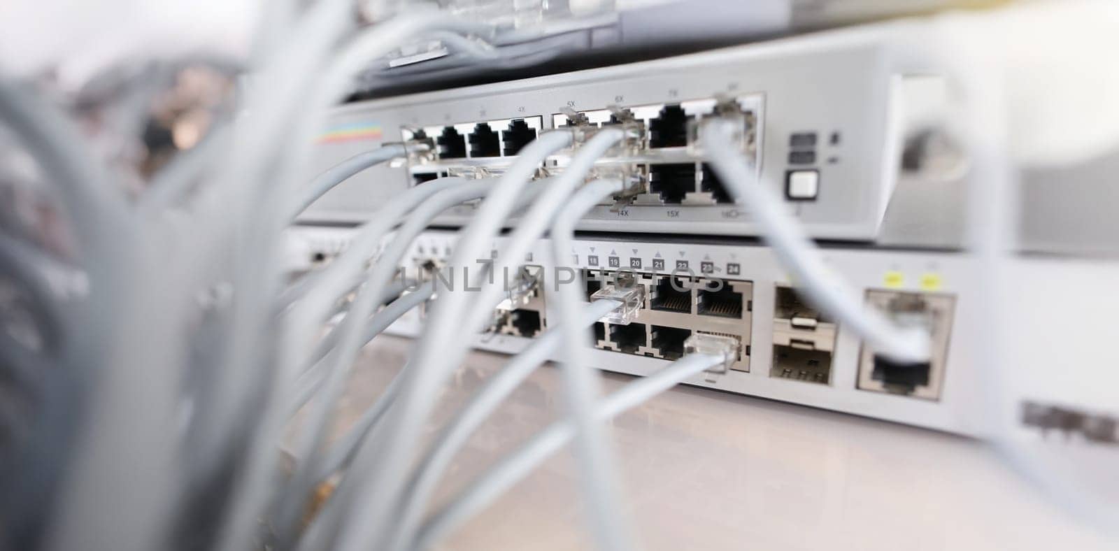 Close-up of set of cable network connected to internet switch servers in center. Control panel with wiring, electrical circuits. Provide internet concept