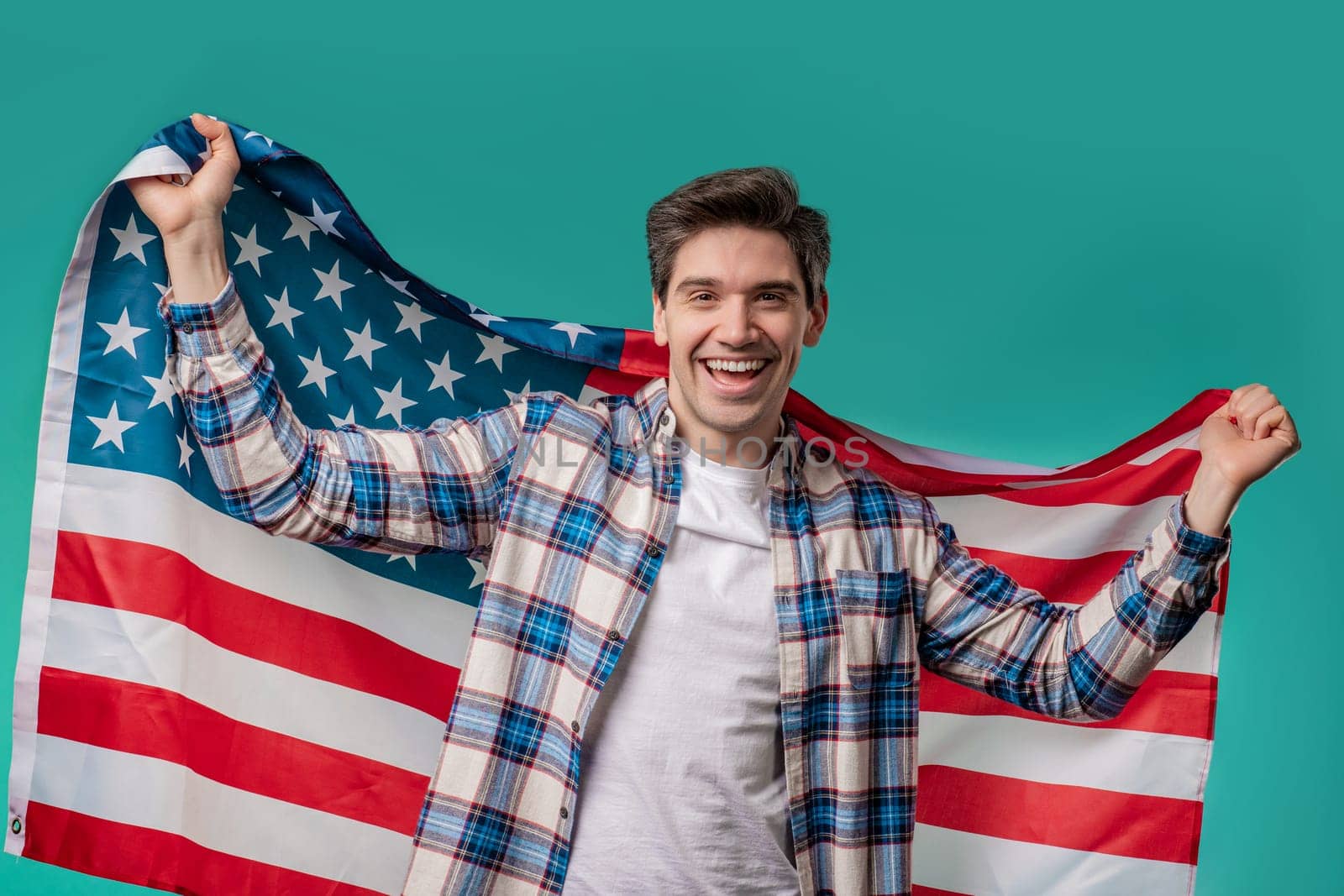 Happy man with national USA flag on blue background. American patriot, 4th of July - Independence day celebration, election, America, labor. US banner. High quality