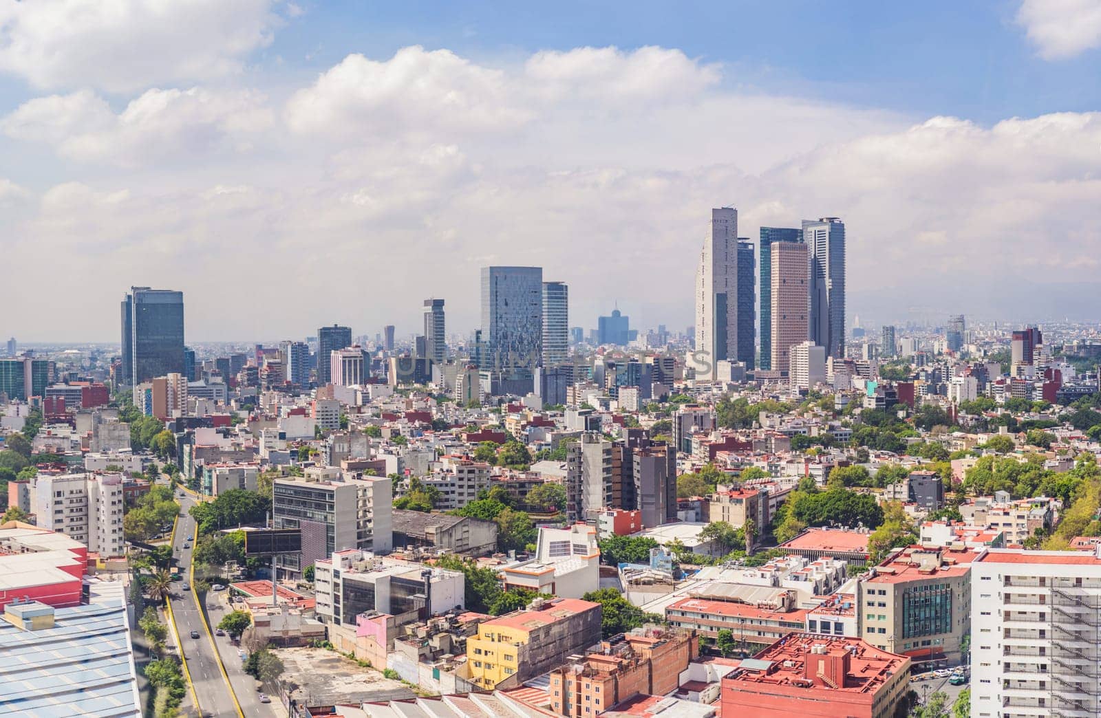 Panoramic view of Mexico City from above, showcasing the sprawling urban landscape, iconic landmarks, and vibrant culture. Cityscape, travel, and architecture concept.