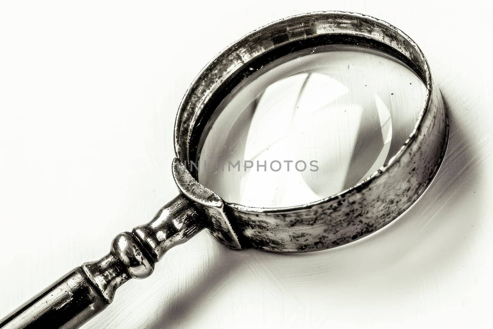 Close up of a magnifying glass isolated on a clean white background for enhanced visual focus