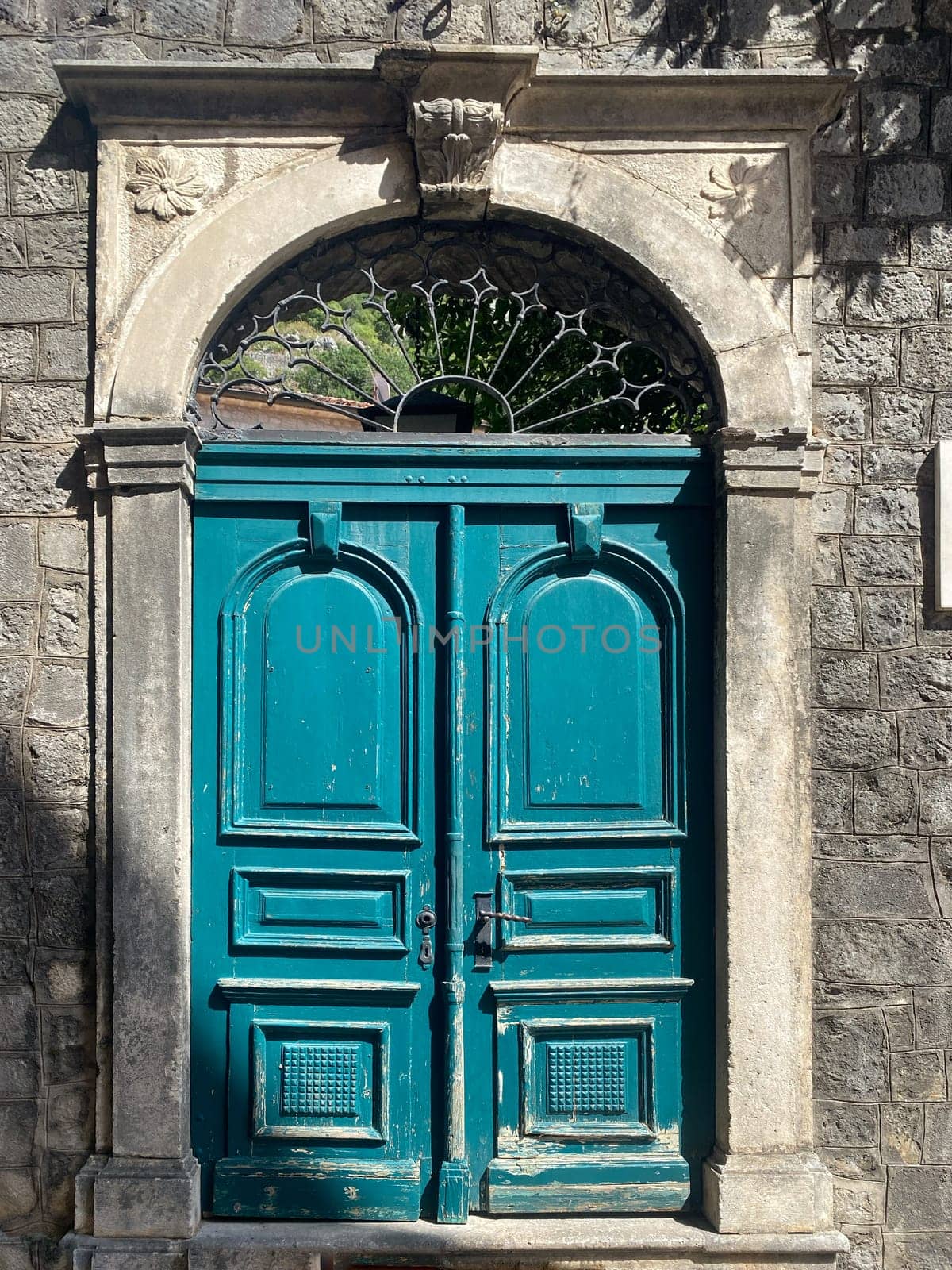Ancient door in the wall of St. Tryphon's Cathedral, Kotor, Montenegro. High quality photo