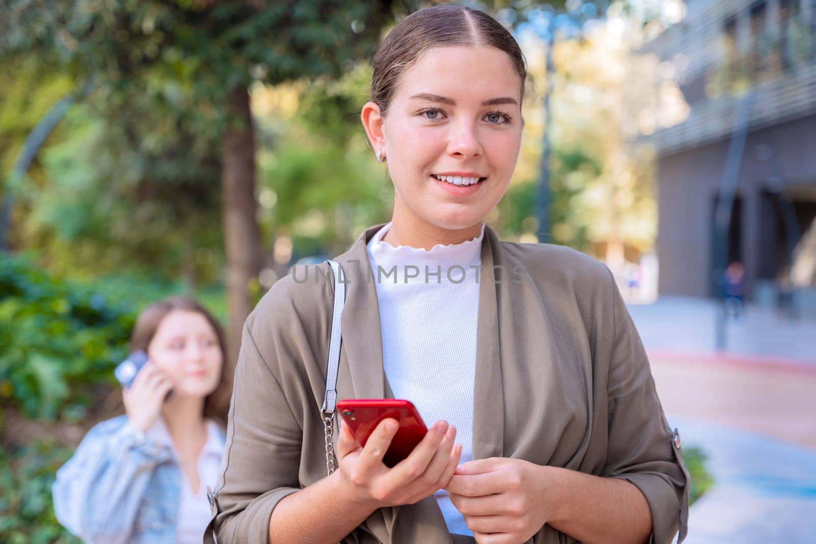 Caucasian woman hands typing on phone browsing telephone on social media.