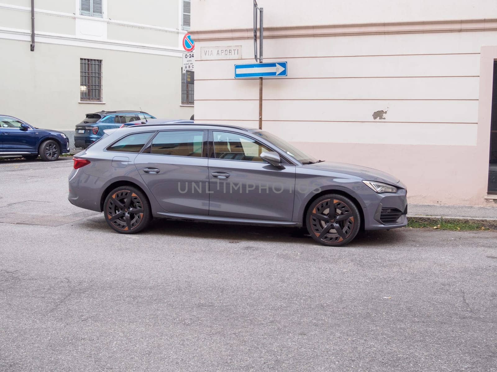 Cremona, Italy September 26th 2024 A stylish Cupra grey station wagon parked on an urban street, showcasing the design and practicality of modern european cars