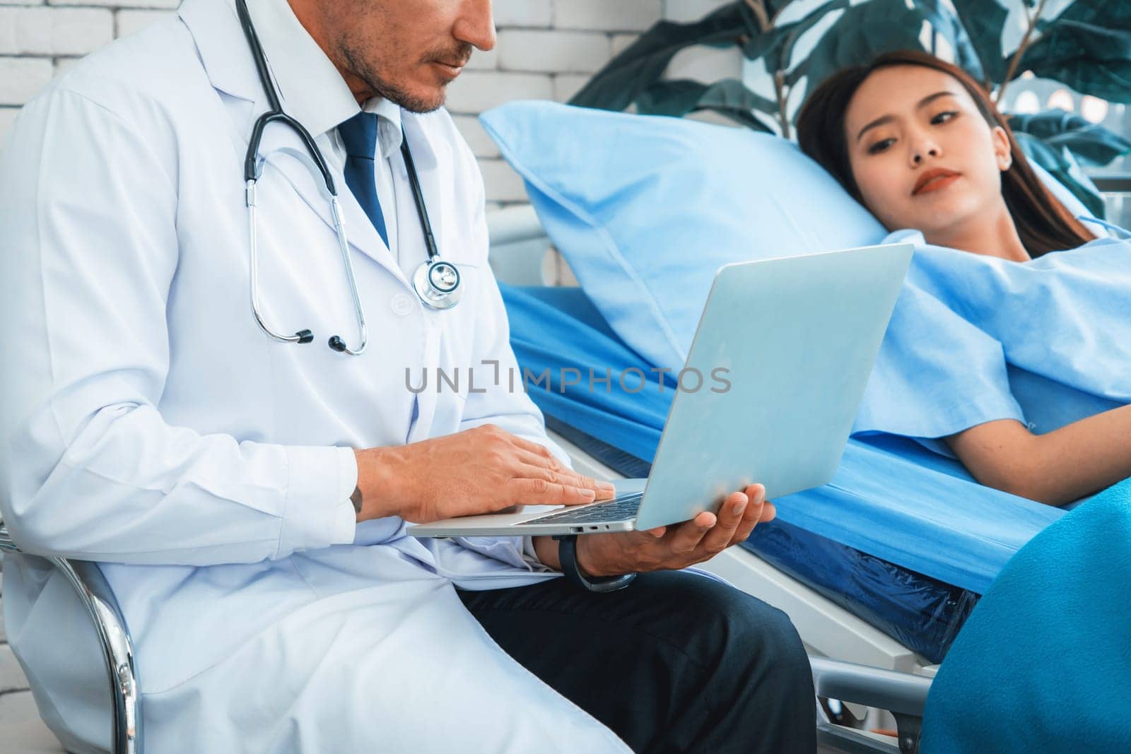 Doctor in professional uniform examining patient at hospital or medical clinic. Health care , medical and doctor staff service concept. Jivy