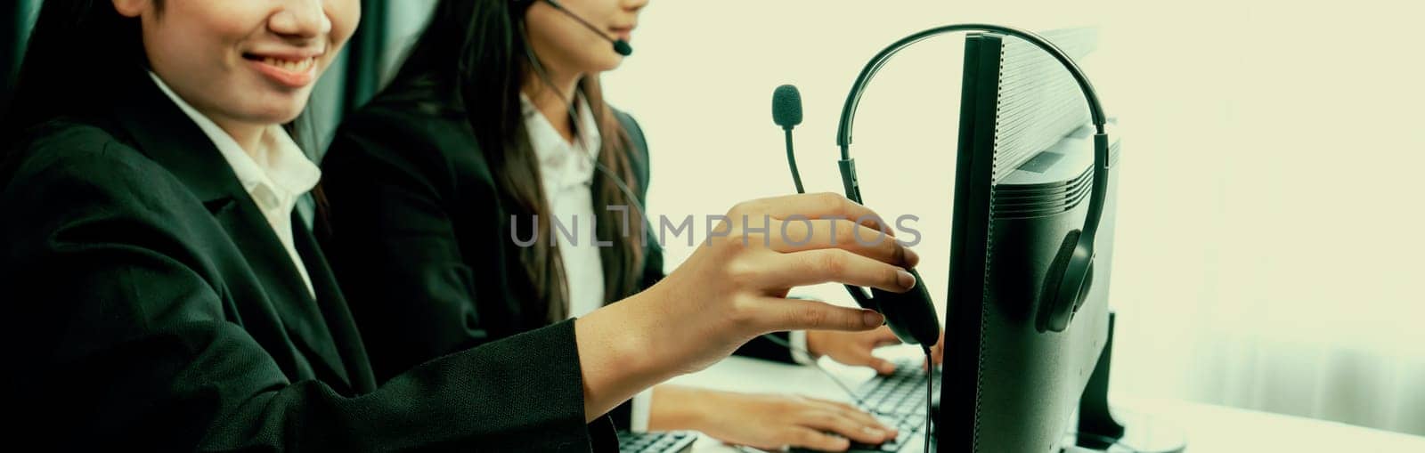 Business people wearing headset working in office to support remote customer or colleague. Call center, telemarketing, customer support agent provide service on telephone video conference oratory call