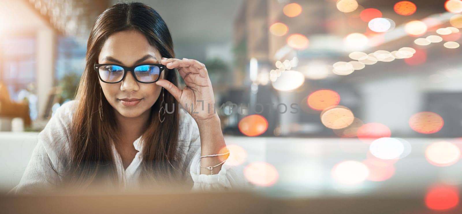 Student, woman and glasses on laptop at cafe for online education, e learning or remote work on banner or bokeh overlay. Young person on computer in vision, reading and online research at coffee shop.