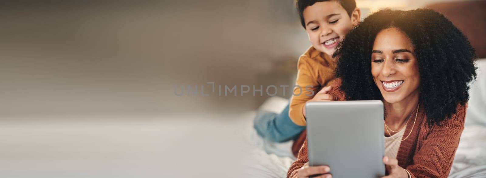 Love, tablet or mother with child on a bed with mockup, social media or streaming subscription at home. Digital, space and mom with kid son in a bedroom happy, relax and online for movies or games.