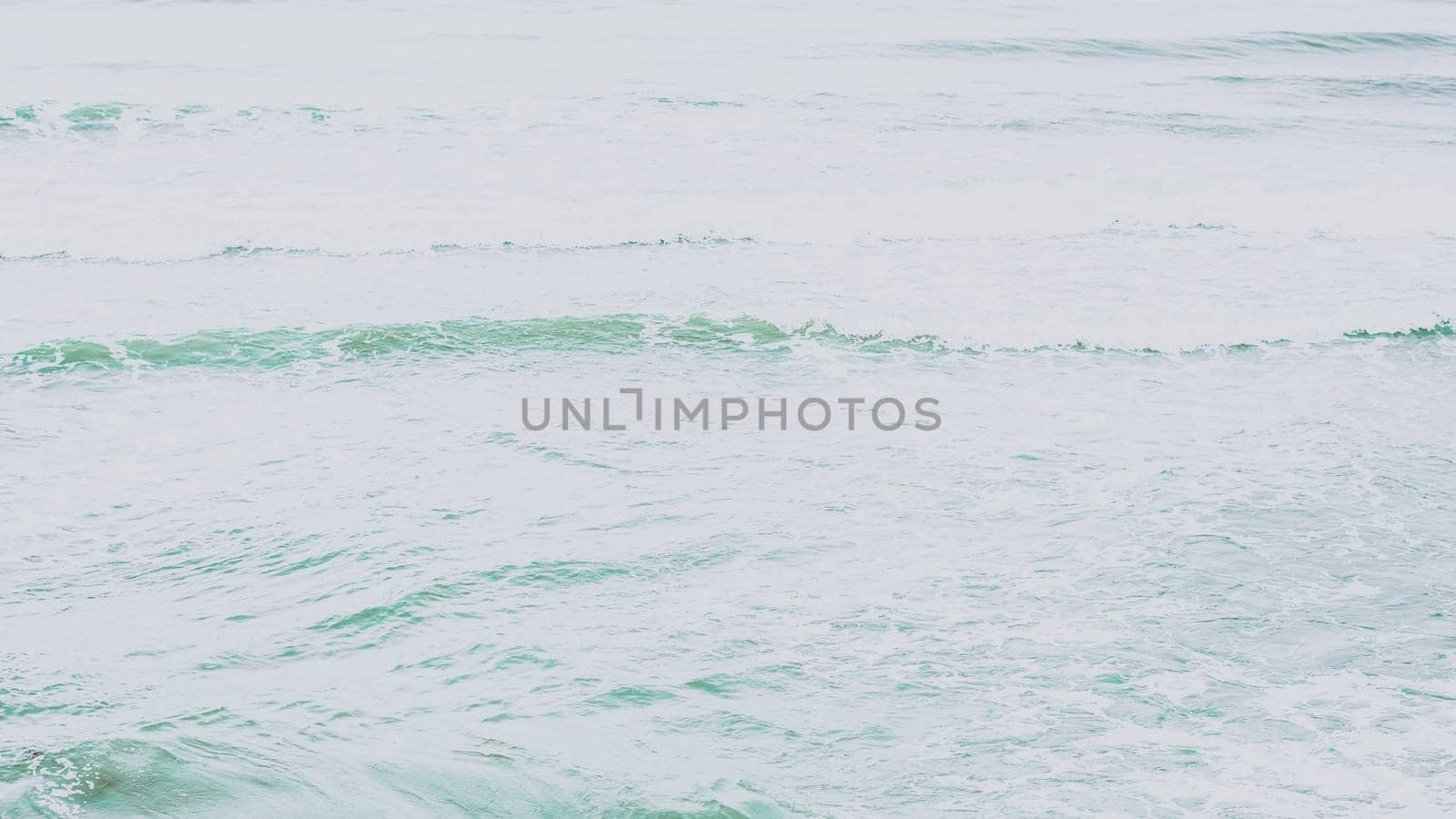 Real photo sea water waves, abstract background, nature power, pale light contrast green matte more tone in stock.