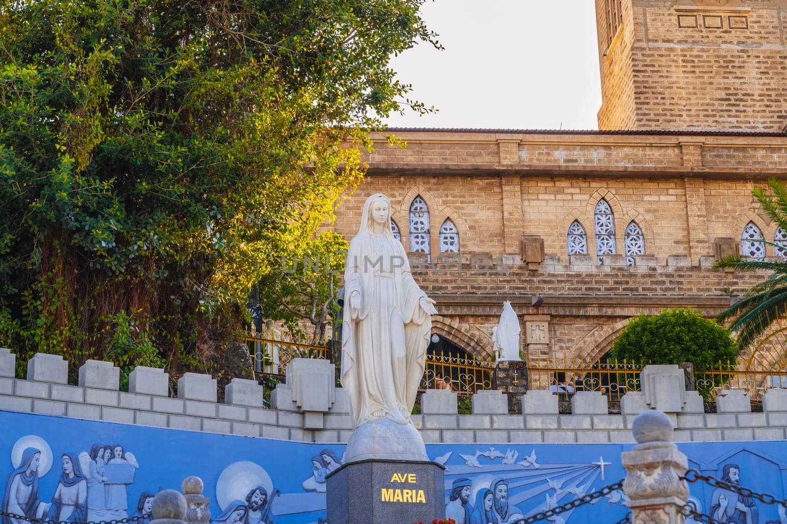 Sculpture of Saint Maria in the square of Nha Trang Cathedral or Stone Church or Christ the King Cathedral in Asia. Nha Trang, Vietnam - August 22, 2024