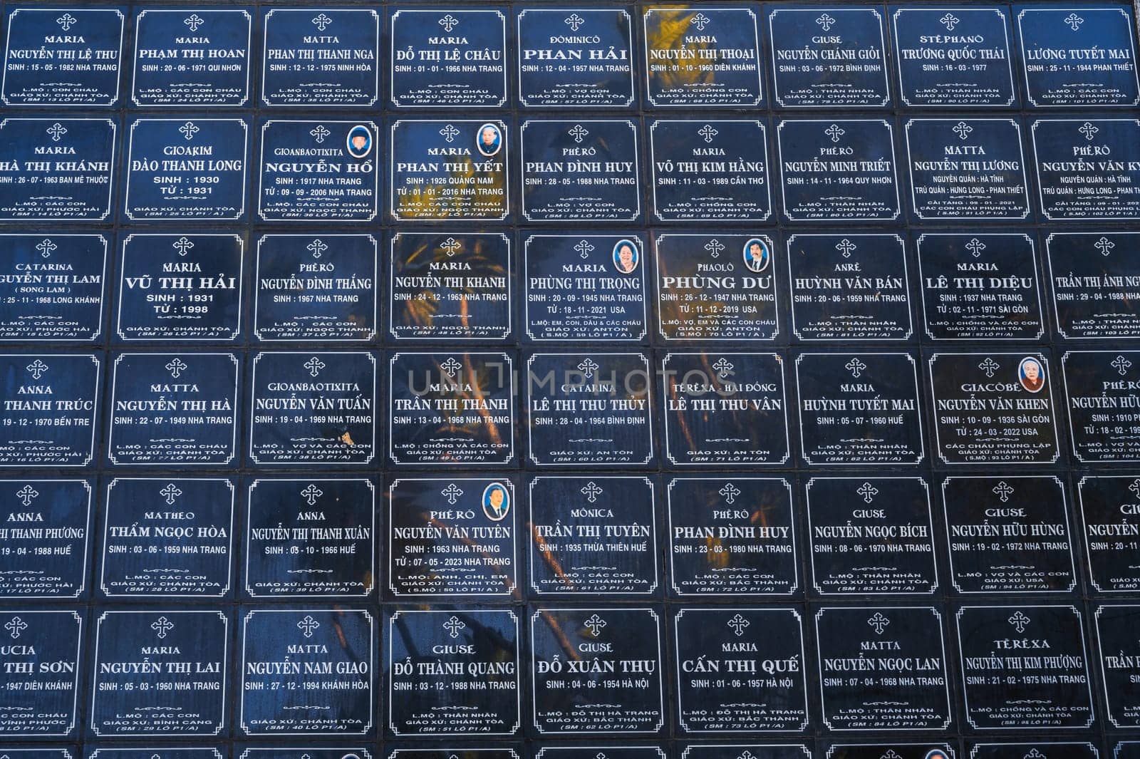Tombstones of deceased Vietnamese near Christ the King Cathedral or Nha Trang Cathedral or Stone Church in Asia. Nha Trang, Vietnam - August 22, 2024